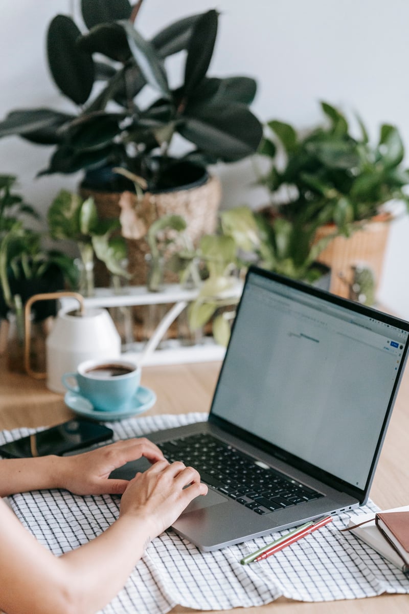 Unrecognizable person typing on laptop